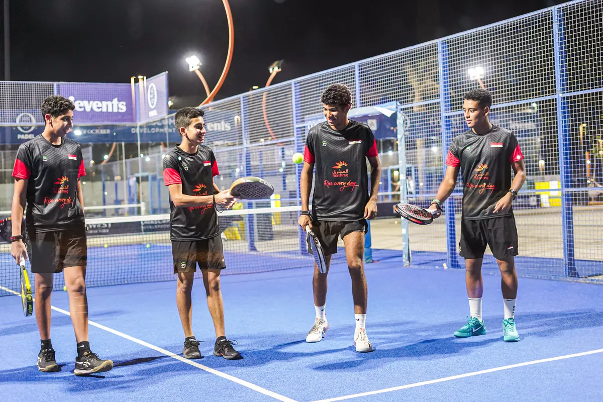 SD players with rackets on a blue SD court